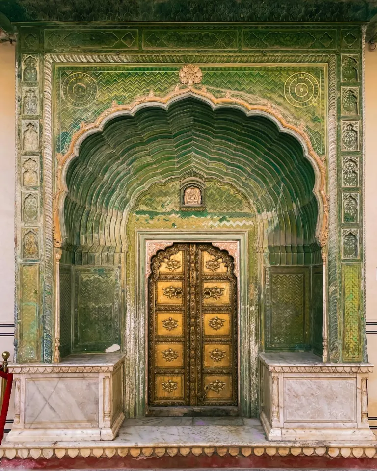 Ornate arched doorway inside the Sheesh Mahal at Amber Fort