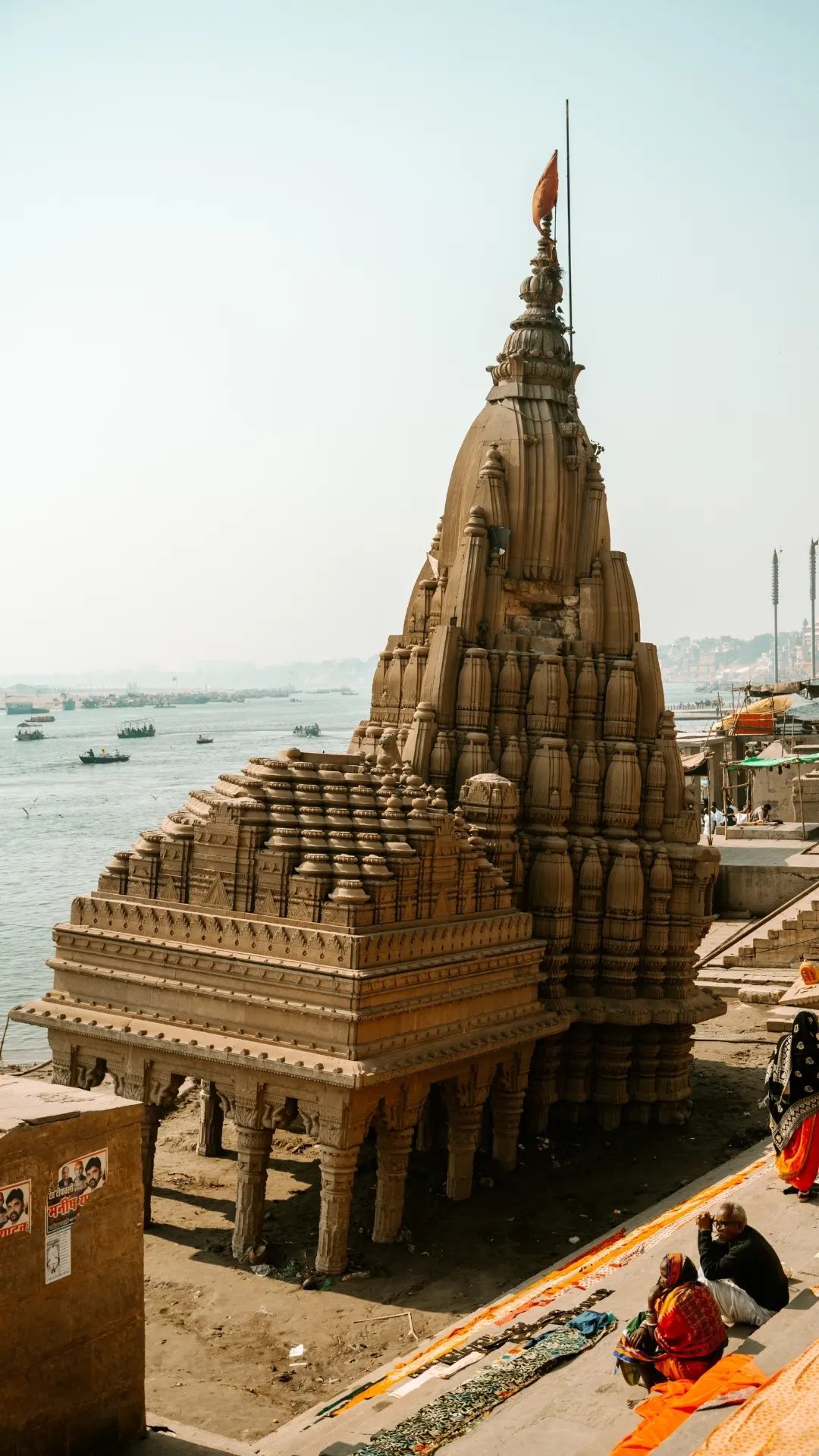 Riverside view of Shivala Ghat with temple structures along the Ganges in Varanasi