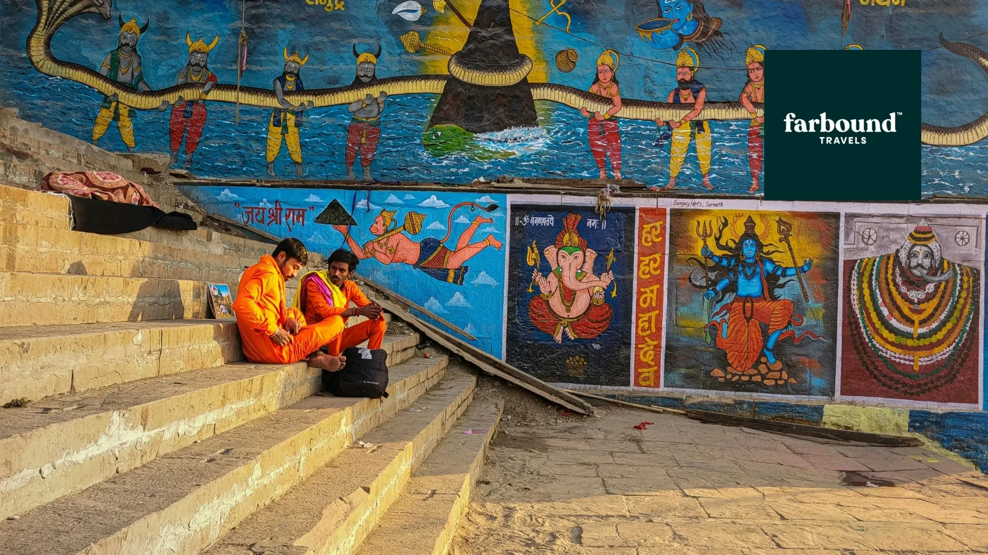 Painted mural and steps descending toward the river at a Varanasi ghat