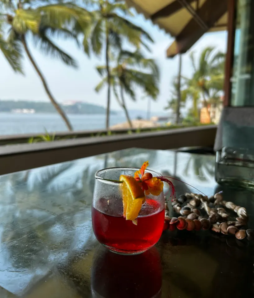 seaside cocktail setup overlooking the ocean at a tropical Goa resort