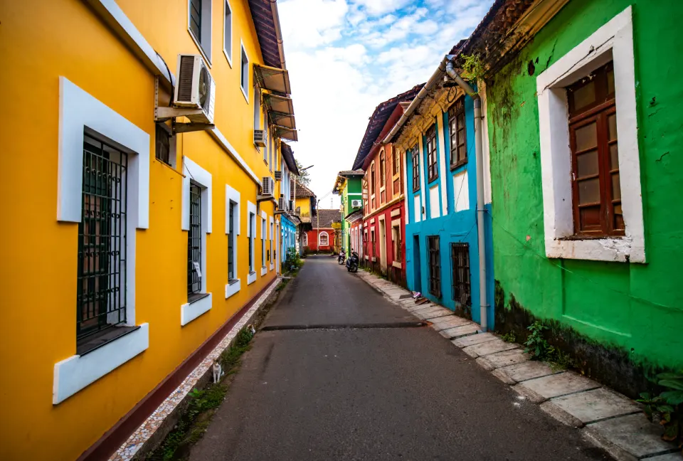 colorful heritage houses along a narrow street in fontainhas goa