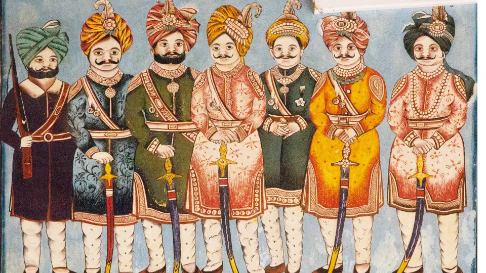 wall mural showing men in traditional attire painted in a mandawa haveli