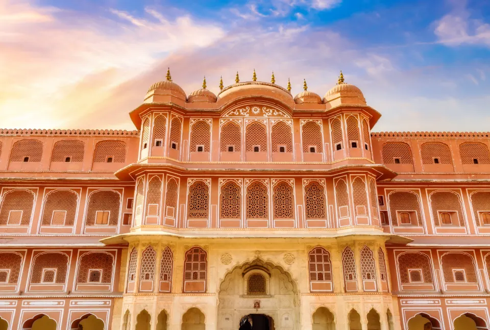 ornate arched facade and painted windows of Samode Palace courtyard