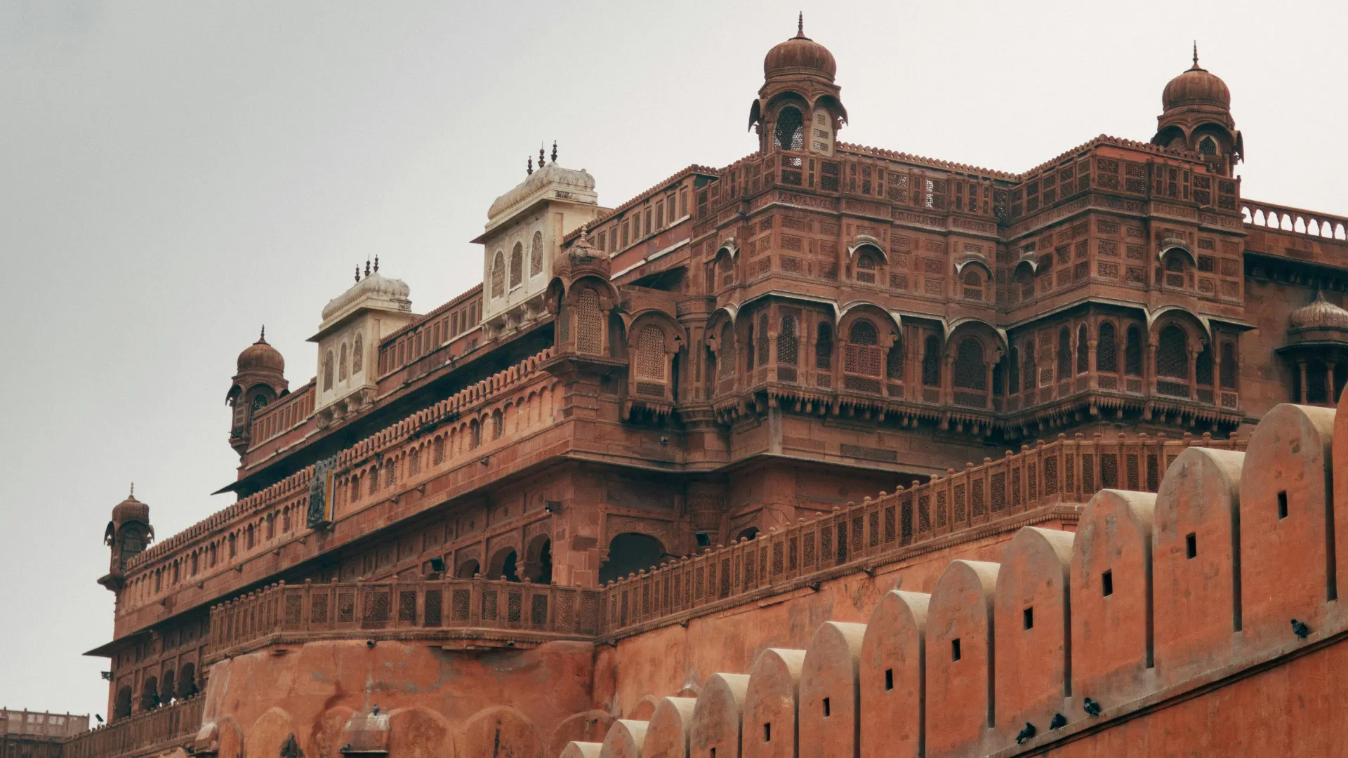 Red sandstone ramparts and upper bastions of Mandawa Fort in Rajasthan