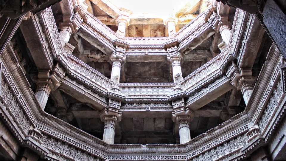 Multi-level carved stone balconies inside Ranakpur Jain Temple courtyard