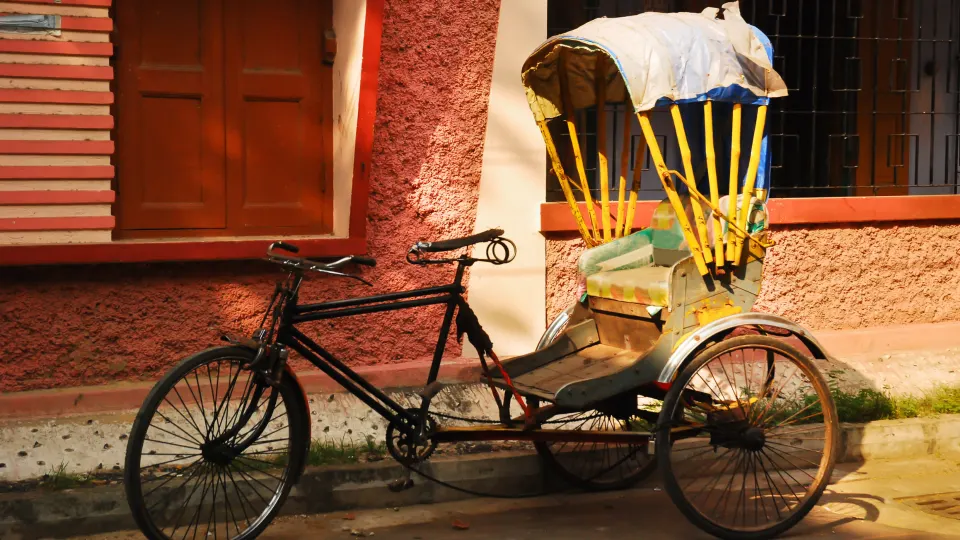 hand pulled rickshaw parked on kolkata street