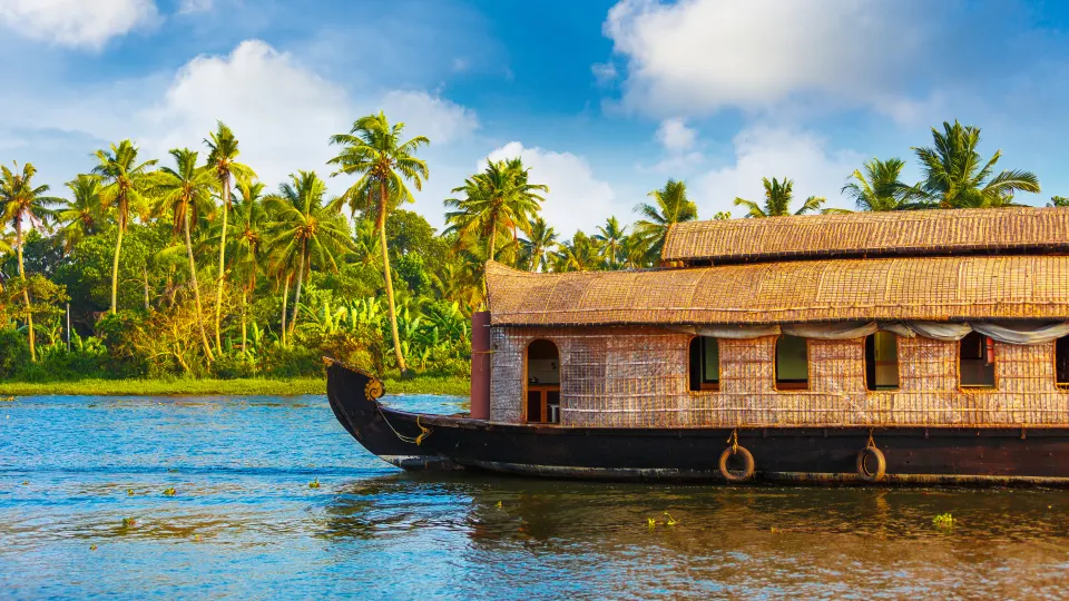 Large traditional houseboat cruising through the Alappuzha backwaters, Kerala