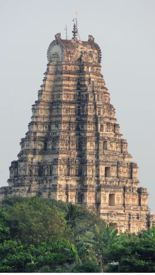 Virupaksha Temple gopuram framed by greenery