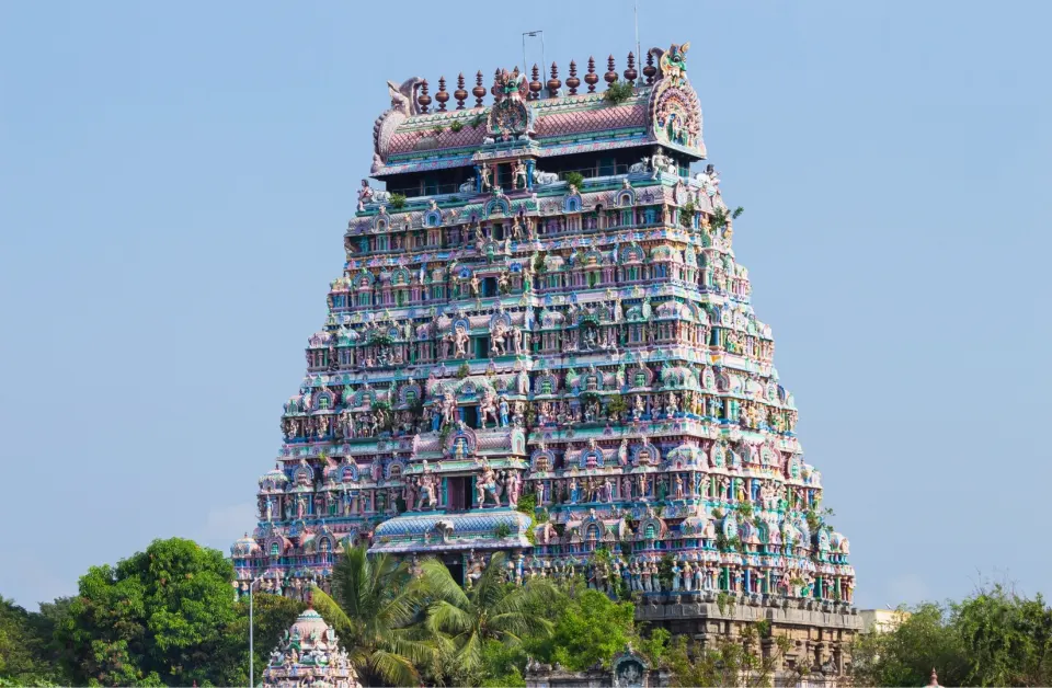 Southern gopuram of Meenakshi Amman Temple against pastel sky, Madurai