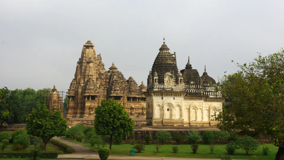 Khajuraho temples with manicured gardens in the foreground
