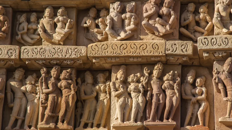 Close-up of detailed stone carvings on a Khajuraho temple façade