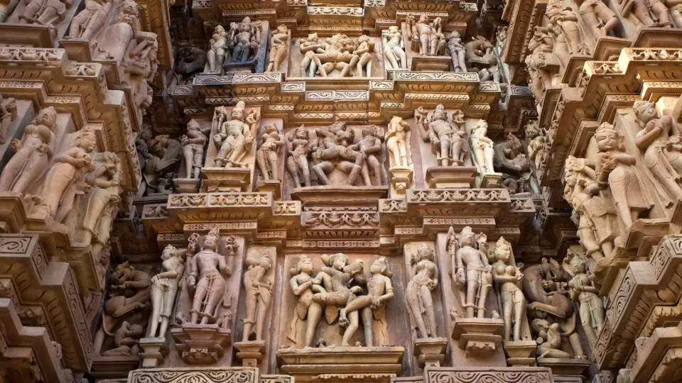 Extremely detailed panel of stone carvings on a Khajuraho temple exterior