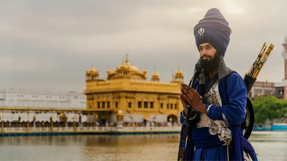 Nihang Sikh in traditional blue attire near the Golden Temple