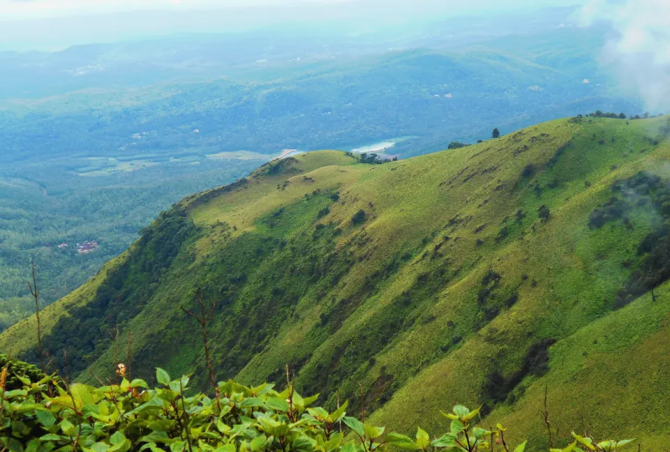Green rolling slopes of Mullayanagiri overlooking vast Western Ghats valleys